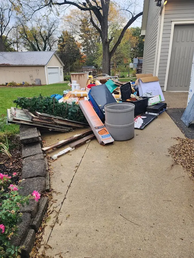 Dumpster being loaded with debris for 3 Yard Dumpster Rental in Airway Heights